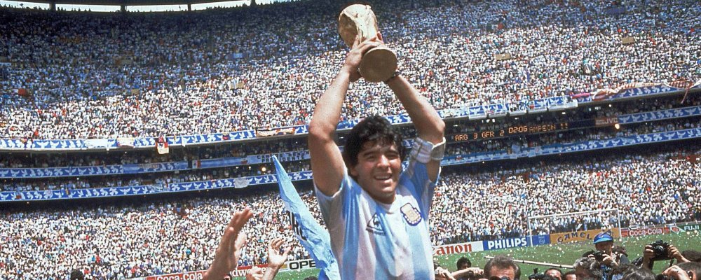 ** FILE ** Argentina's Diego Maradona, holding up the trophy, is carried on shoulders as he celebrates at the end of the World Cup soccer final game against West Germany at the Atzeca Stadium, in Mexico City, in this June 29, 1986, file photo. Argentina won 3-2. Maradona and Argentinean coach Carlos Bilardo have been asked to lead Argentina by Julio Grondona, head of the Argentine Football Association, Tuesday, Oct. 28, 2008. (AP Photo/Carlo Fumagalli, file)